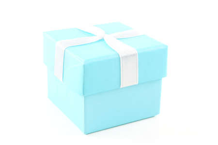 Baby blue gift box with white ribbon against a white background.の写真素材