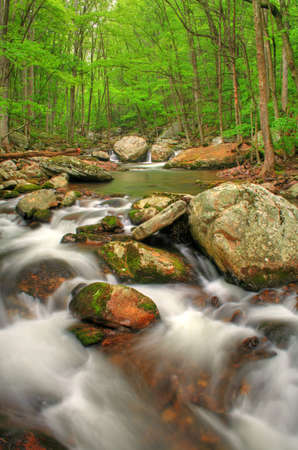 Beautiful creek right after a Spring rain with lots of boulders. HDR image.の写真素材