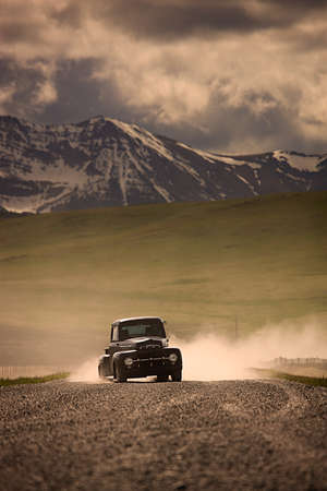 Old truck on mountain roadの写真素材