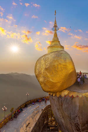 Dramatic picture of the golden rock pilgrimage site in Myanmar Burma.  Held in place by a hair of the Buddha.のeditorial素材