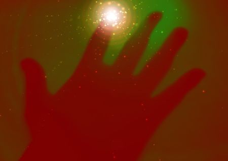 Illustration of a hand touching the screen with sparkles coming from the contact pointの写真素材