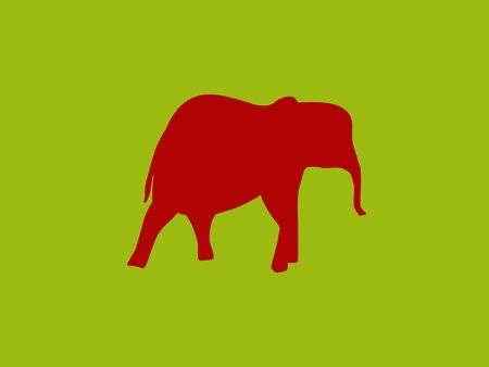 red elephant on a green colored backgroundの写真素材