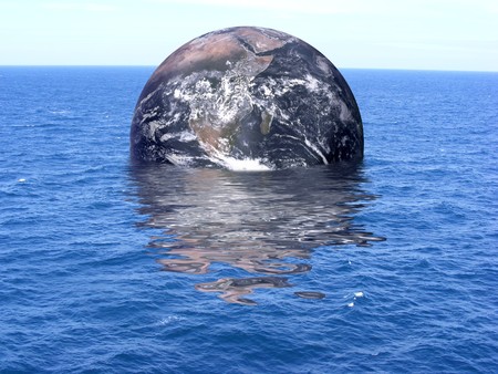 Planet Earth floating in an oceanの写真素材