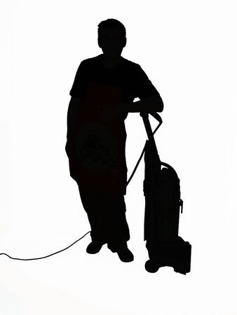 Silhouette of a man leaning on a vacuum cleaner の写真素材