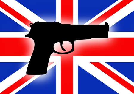 Silhouette of a gun over a flag of the United Kingdomの写真素材