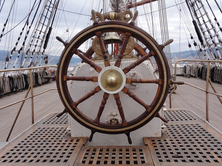 a wooden and brass ship wheelの写真素材