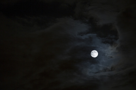 Full moon on a dark nightの写真素材