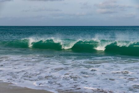 Waves breaking on sand beach, Sal Rei, Boa Vista, Cape Verdeの写真素材
