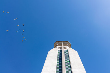 Pigeons flying around the clock tower of Ermita de Nuestra Senora de Bonanza Church, El Paso, La Palma, Canary Islands, Spain September 2018のeditorial素材