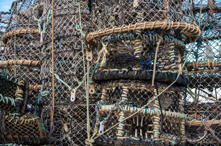 Fishing nets and lobster pots on the quaysideの写真素材