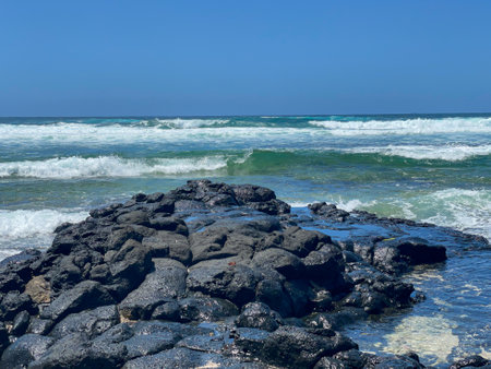 Rocks, reef lagoon and waves breaking at Poste LaFayette public beach, Mauritiusの写真素材