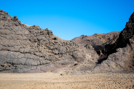 Ventifact rock formations caused by wind at La Pared Beach, Fuerteventura, Spainの写真素材