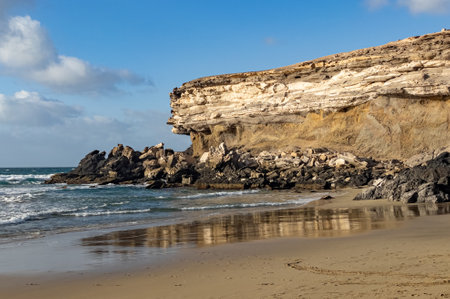 Ventifact rock formations caused by wind at La Pared Beach, Fuerteventura, Spainの写真素材