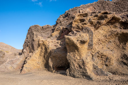 Ventifact rock formations caused by wind at La Pared Beach, Fuerteventura, Spainの写真素材