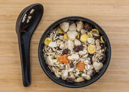 Muesli in the dish with the spoonの写真素材