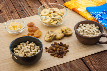 Dried fruits and the nuts on the tableの写真素材