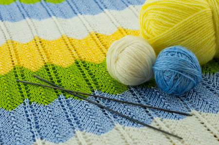 the skeins of colorful thread and the needlesの写真素材