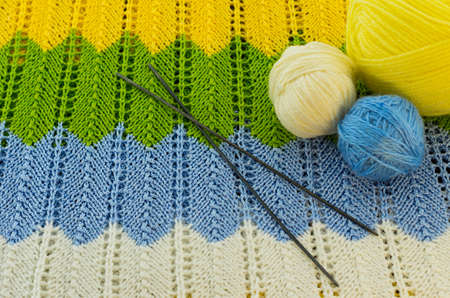 the skeins of colorful thread and the needles