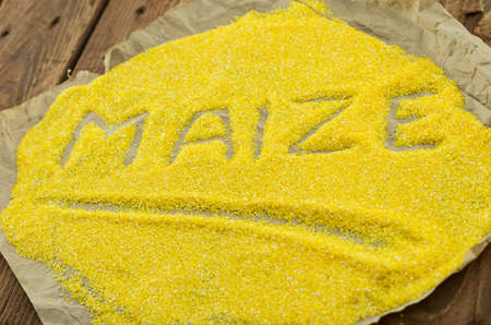 The yellow corn grits on the wrapping-paperの写真素材