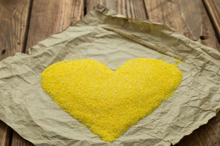 The yellow corn grits on the wrapping-paperの写真素材