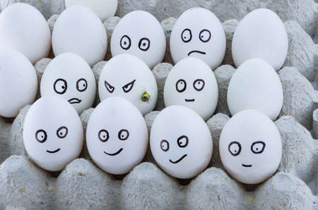 Cardboard egg tray with chicken eggs. Social concept: Stop terrorism. Angle view.の写真素材