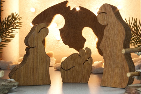 handmade wooden crib with lights in the background