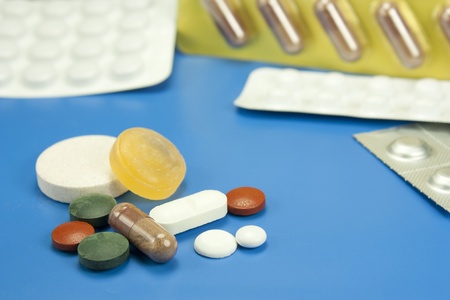 medicines and pills in different shapes and colorsの写真素材