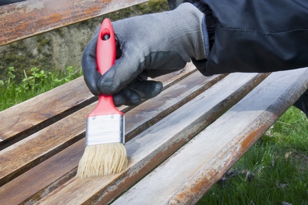 man while painting a benchの写真素材
