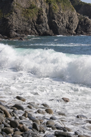 wave of the sea while breaking on the beachの写真素材