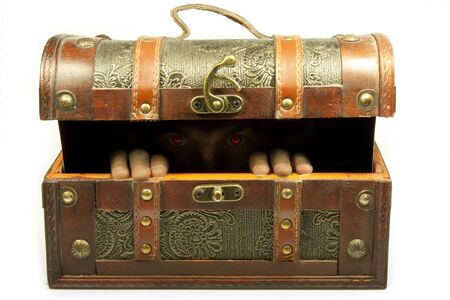 left eyes in dim light inside a trunk ajarの写真素材