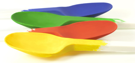 spoons painted in four different colorsの写真素材