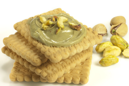 cake with pistachio cream and cookiesの写真素材