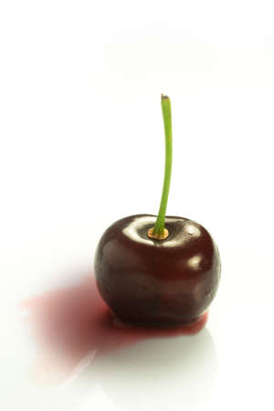 red ripe cherries on a white backgroundの写真素材