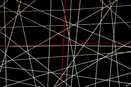 twisted white wires that trap red heartの写真素材