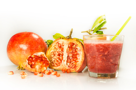 glass containing milky juice juice with fruit in evidenceの写真素材