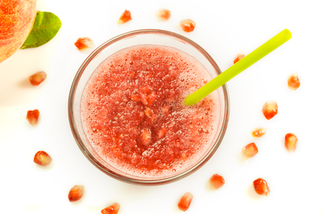glass containing milky juice juice with fruit in evidenceの写真素材