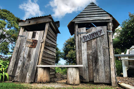 Classic country outhouse toilets with waiting area providedの写真素材