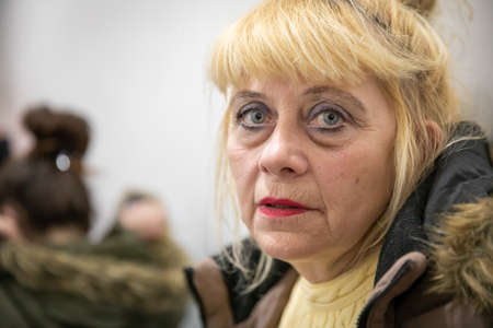 Dnipro, Ukraine - Mar 16, 2022 Volunteers, woman, refugees, face, asylum, people, center, families, humanitarian, aid, people, Ukraine,のeditorial素材