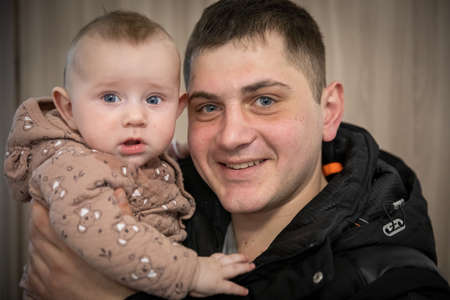 Dnipro, Ukraine - Mar 16, 2022 Volunteers, man, girl, refugee, face, asylum, people, center, families, humanitarian, aid, people, Ukraine,のeditorial素材