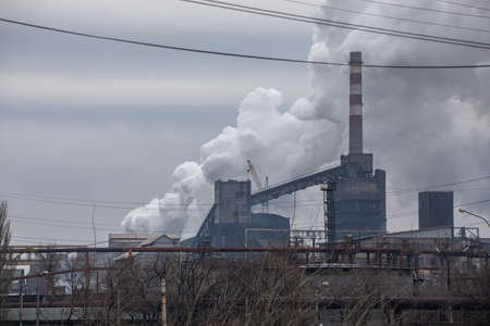Mariupol, Ukraine - Feb 24, 2022 Bridge, river, factory, steel plant, bombing, rain, smoke, chimney, industrial, ironworks,のeditorial素材