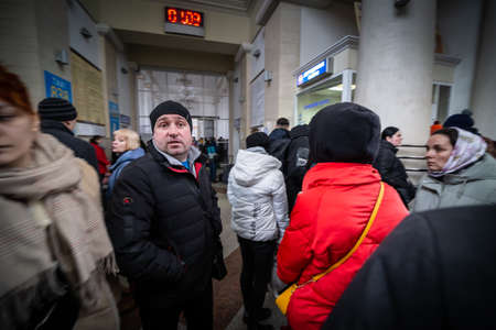 Dnipro, Ukraine - Mar 1, 2022 railway station, man, fear, aid, refugees, front, people, families,...