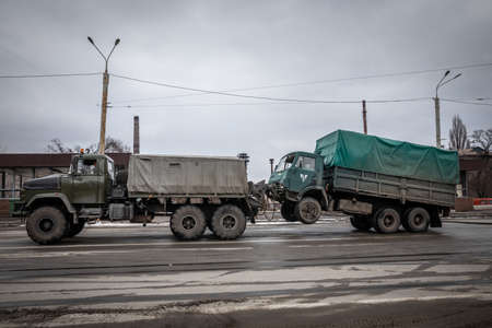 Dnipro, Ukraine Mar 11, 2022: neighborhood, rocket, house, fire, bomb, shooting, car, road, people,のeditorial素材