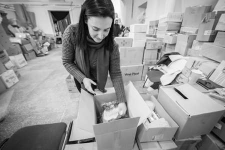 Dnipro, Ukraine - Mar 16, 2022 Volunteers, woman, box, humanitarian, aid, people, Ukraine,のeditorial素材