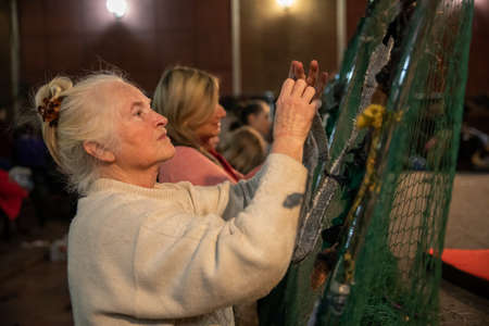 Dnipro, Ukraine - Mar 16, 2022 Volunteers, woman, network, camouflage, humanitarian, aid, people,...
