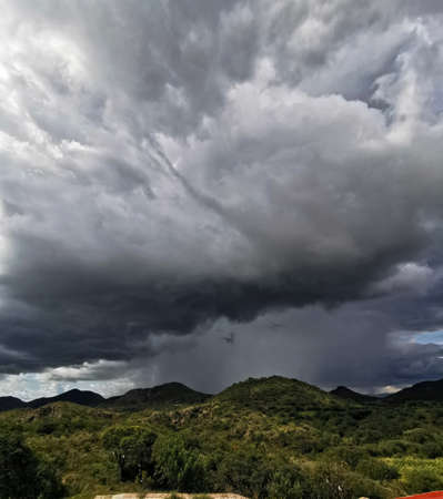 Photograph of rain falling on the mountains captured in the Sierra de Oaxaca in Mexicoの写真素材