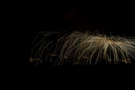 circular sparks of metallurgy on black background