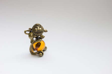 Lion on te ball zodiac sign gold colorの写真素材