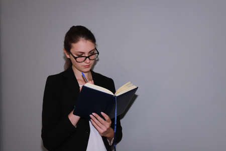 work break - young business woman resting and reading a bookの写真素材