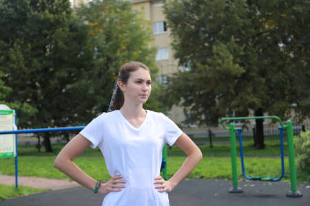 let's keep fit - young girl exercising outdoorsの写真素材