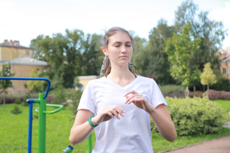 let's keep fit - young girl exercising outdoorsの写真素材